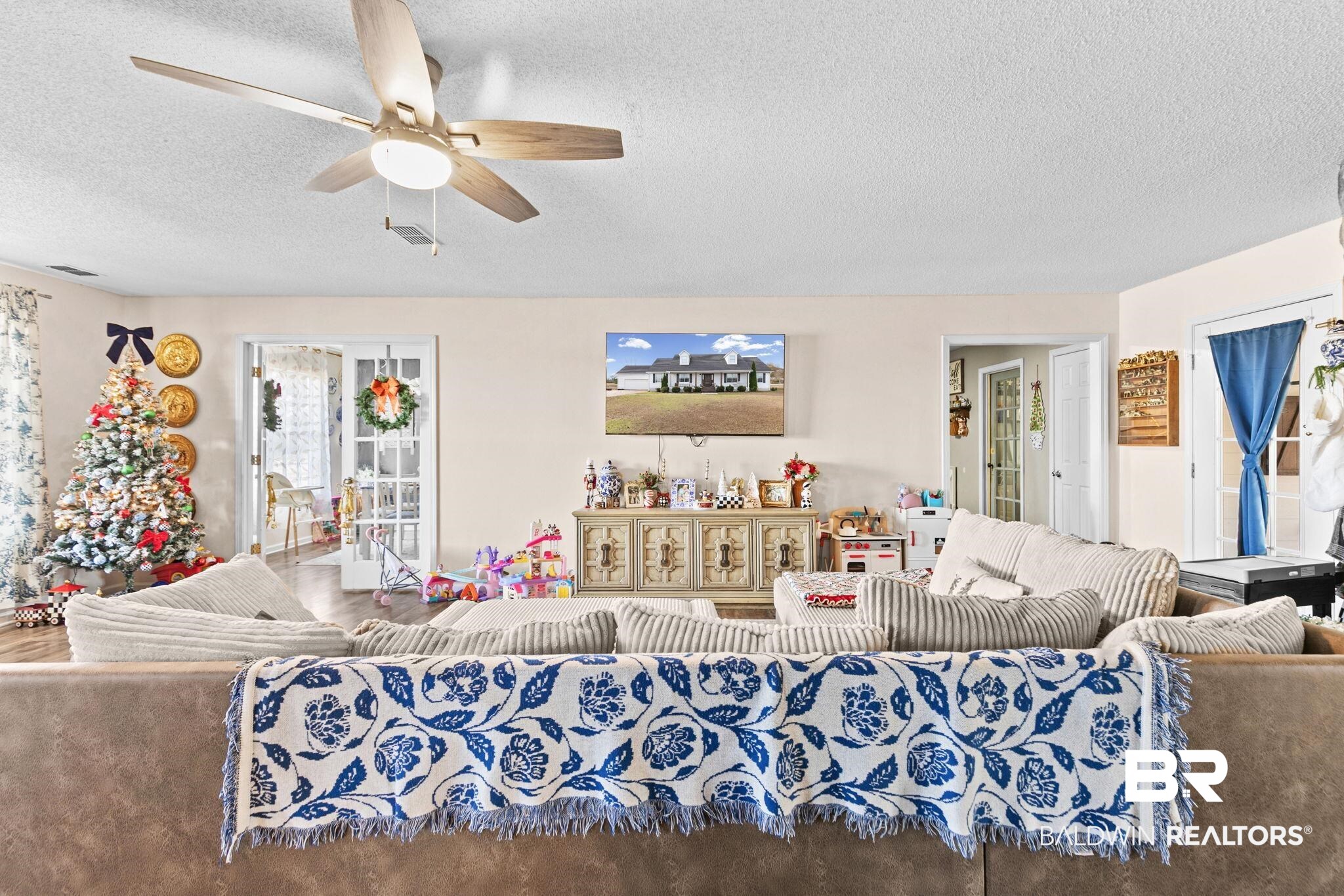 3842 Experiment Farm Road Monroeville, AL 36460 - Photo 17 of 59 Living area with a textured ceiling and ceiling fan