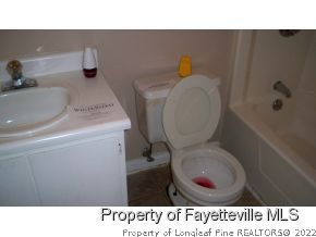2283 Hackney Loop Fayetteville, NC 28304 - Photo 11 of 14 a bathroom with a toilet and a sink