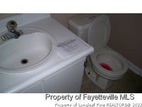 2283 Hackney Loop Fayetteville, NC 28304 - Photo 12 of 14 a bathroom with a sink and a toilet