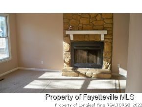 2283 Hackney Loop Fayetteville, NC 28304 - Photo 2 of 14 a black and white photo of a fireplace