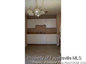 2283 Hackney Loop Fayetteville, NC 28304 - Photo 4 of 14 a picture of a bench in a room