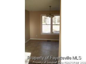 2283 Hackney Loop Fayetteville, NC 28304 - Photo 6 of 14 a view of an empty room with a window