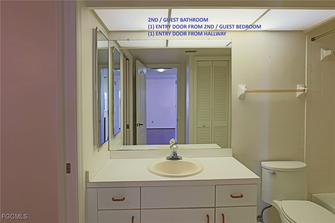 13220 Whitehaven Lane, Unit 1402 Fort Myers, FL 33966 - Photo 27 of 43 a bathroom with a sink and a mirror