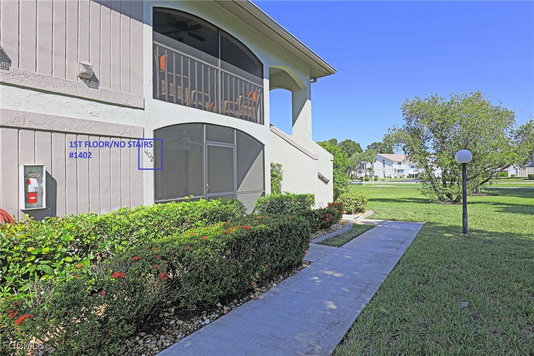13220 Whitehaven Lane, Unit 1402 Fort Myers, FL 33966 - Photo 3 of 43 a view of a house with backyard