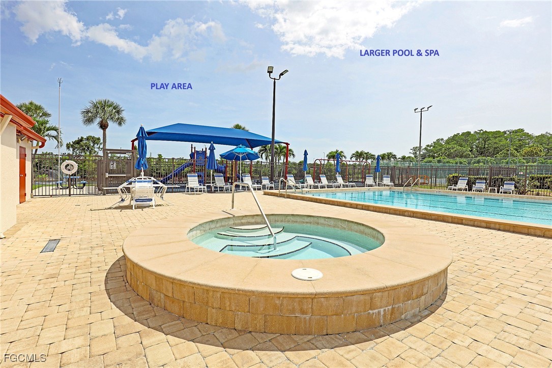 13220 Whitehaven Lane, Unit 1402 Fort Myers, FL 33966 - Photo 36 of 43 a swimming pool with outdoor seating and yard in the back