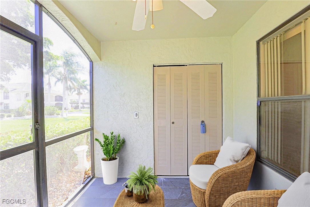 13220 Whitehaven Lane, Unit 1402 Fort Myers, FL 33966 - Photo 7 of 43 a living room with furniture and a potted plant
