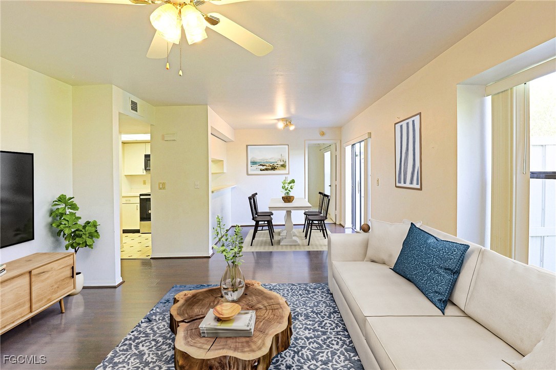 13220 Whitehaven Lane, Unit 1402 Fort Myers, FL 33966 - Photo 10 of 43 a living room with furniture and a potted plant
