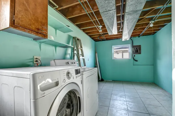 a view of a storage & utility room with washer and dryer