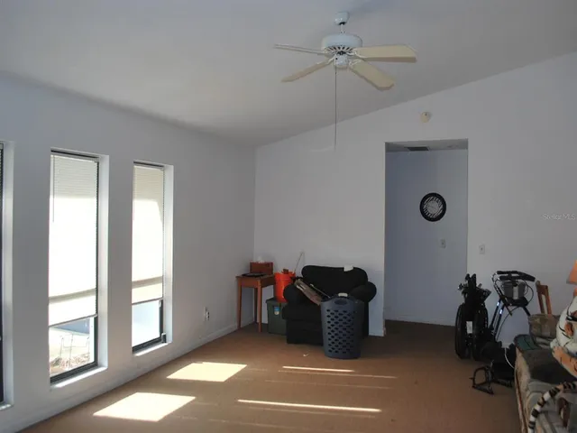 a view of a livingroom with furniture and windows