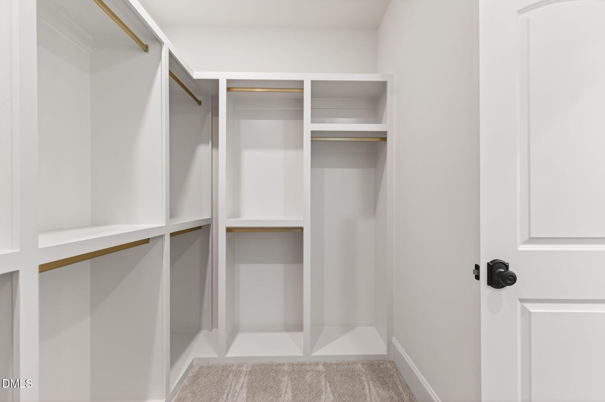 651 Dixon Road, Unit (LOT 2A) Willow Spring, NC 27592 - Photo 22 of 77 a view of walk in closet with empty racks
