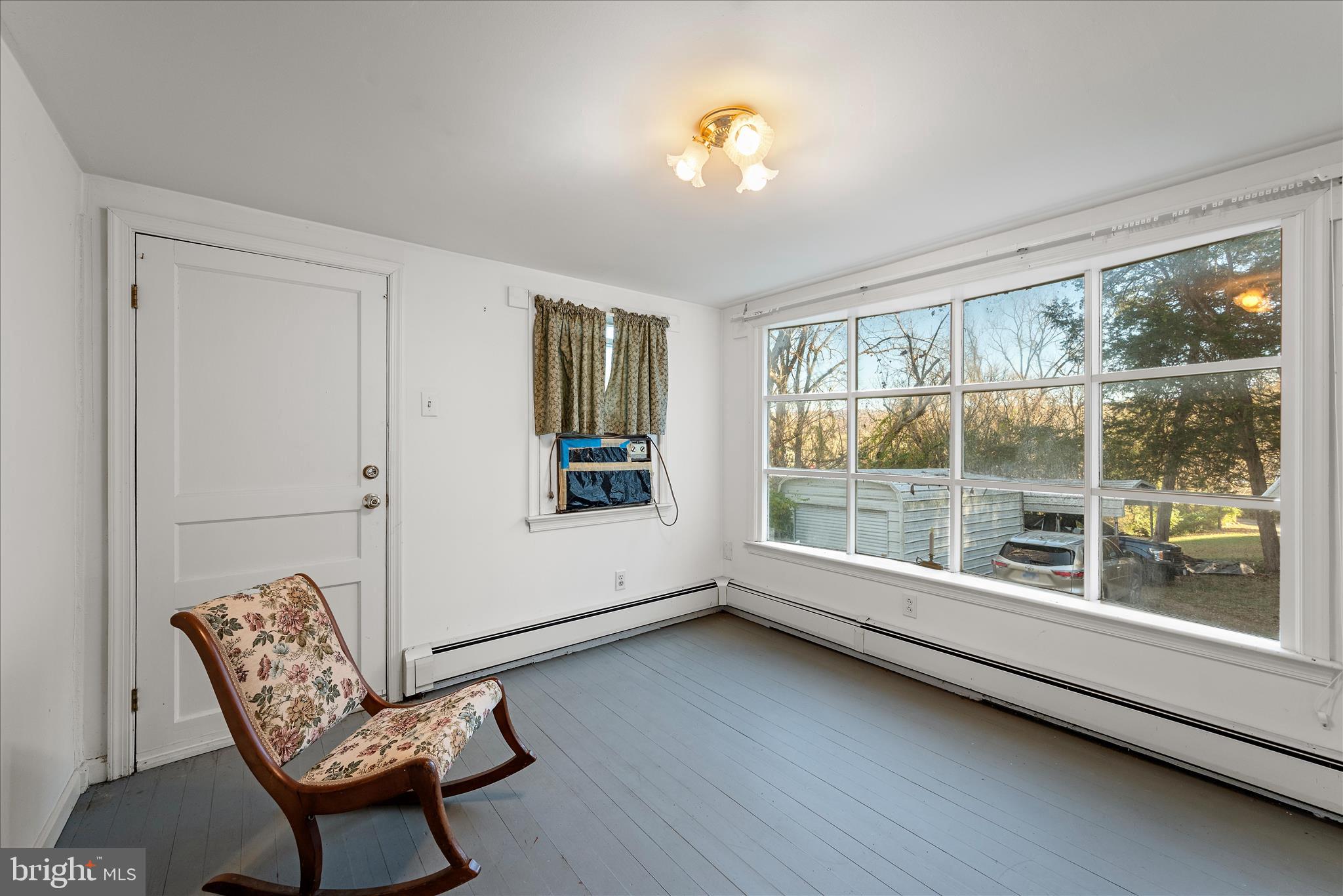 1621 Locke's Mill Road Berryville, VA 22611 - Photo 16 of 54 a view of a livingroom with furniture and a window