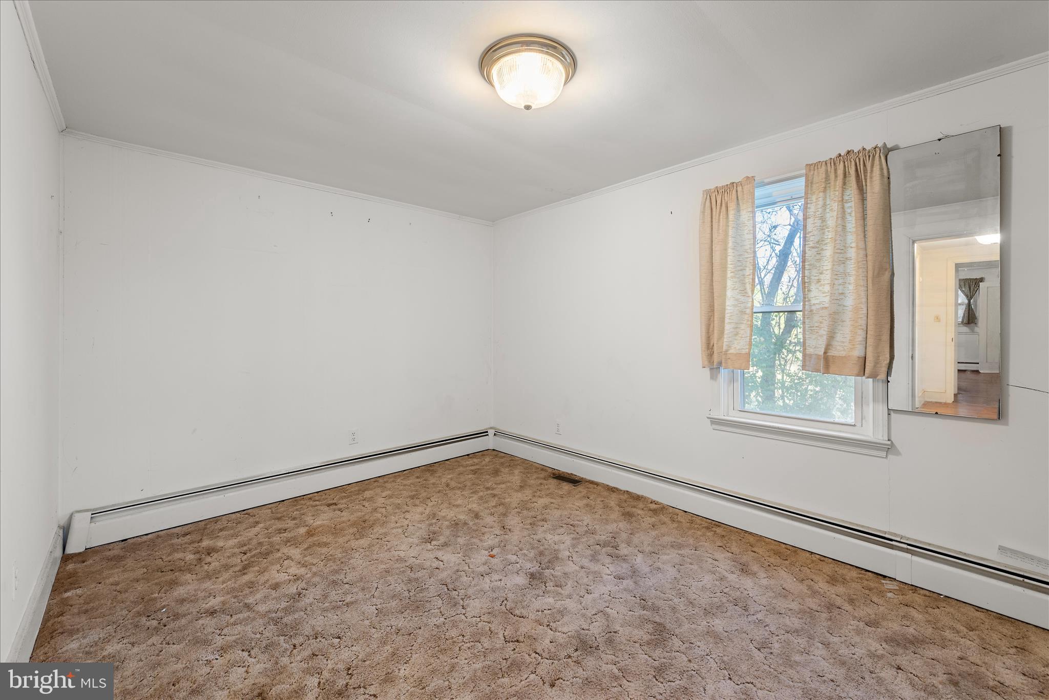 1621 Locke's Mill Road Berryville, VA 22611 - Photo 17 of 54 an empty room with a window