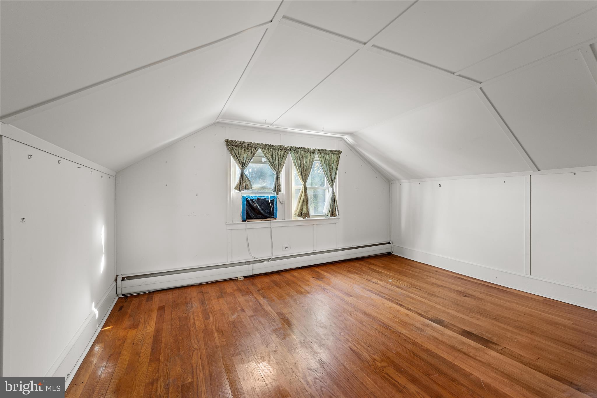 1621 Locke's Mill Road Berryville, VA 22611 - Photo 27 of 54 an empty room with wooden floor and windows