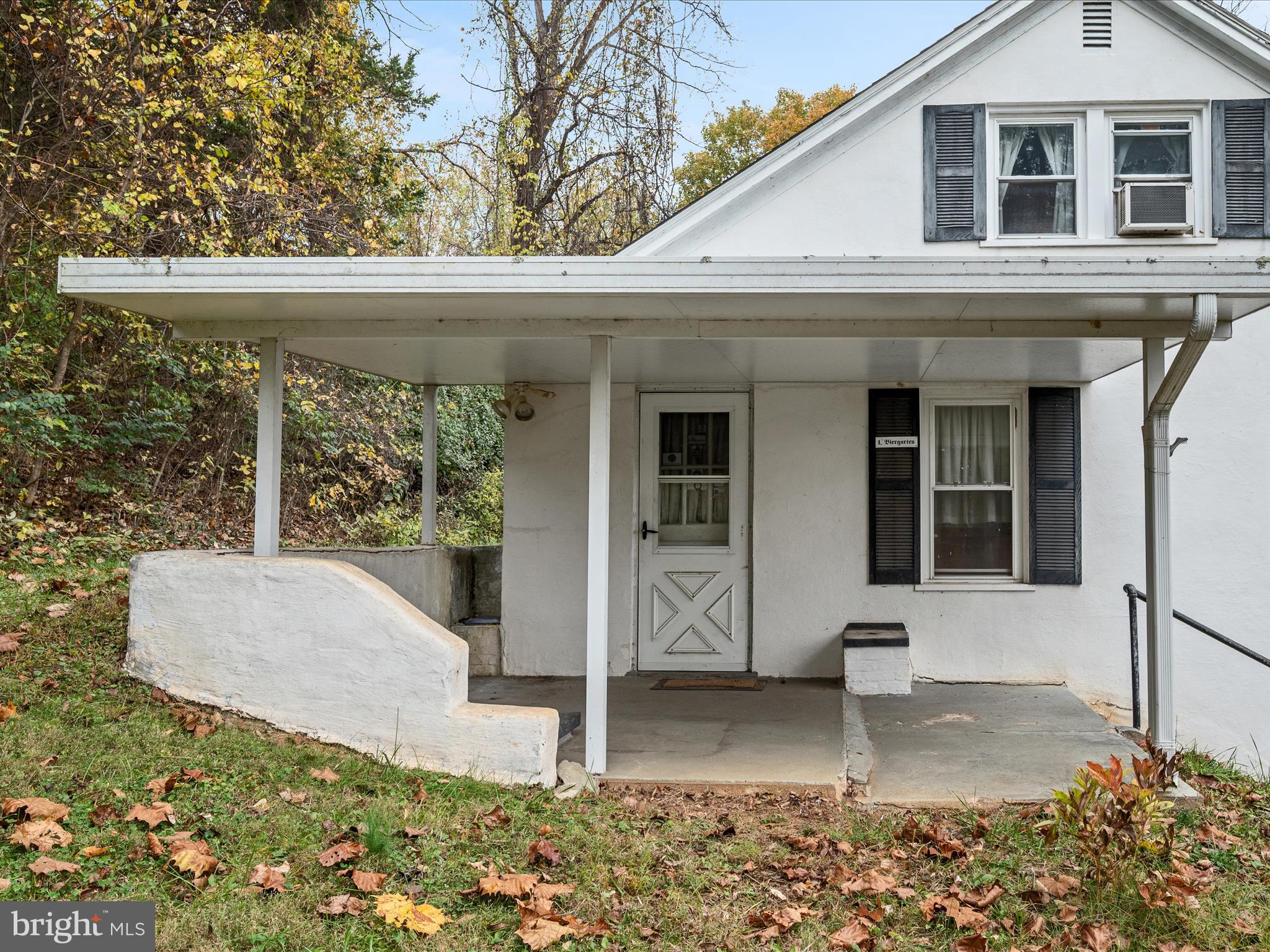 1621 Locke's Mill Road Berryville, VA 22611 - Photo 4 of 54 a front view of a house with garden