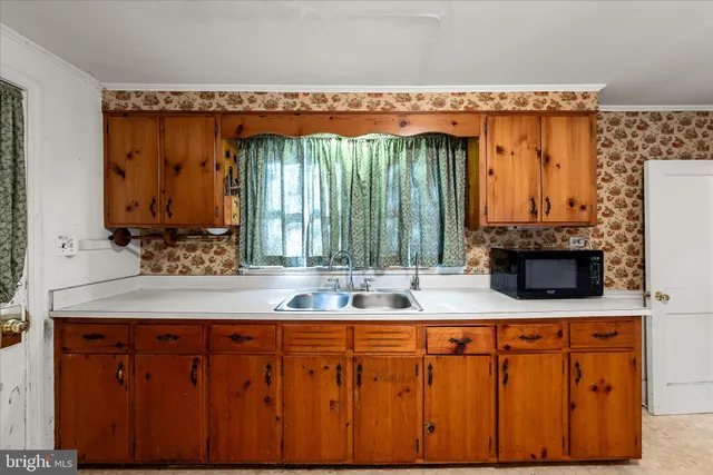 a view of a room with wooden walls
