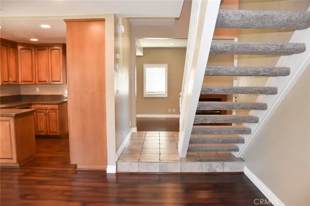 a view of staircase with white walls and a window