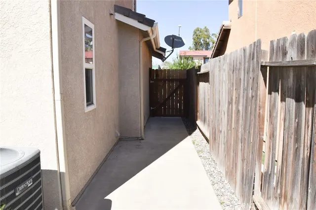 a view of a house with backyard and porch