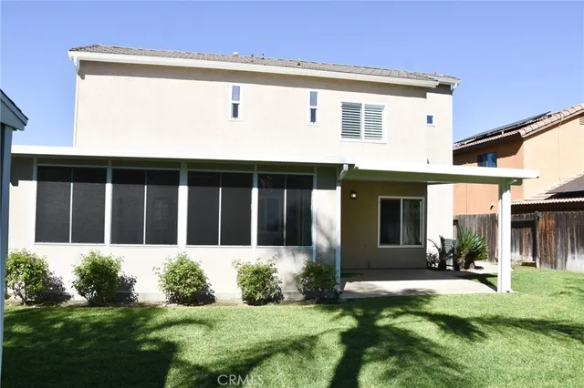 a backyard of a house with seating space