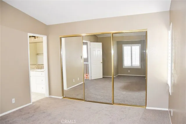 a view of an empty room with a balcony