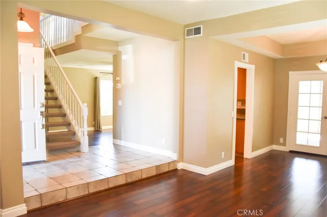 a view of entryway with wooden floor