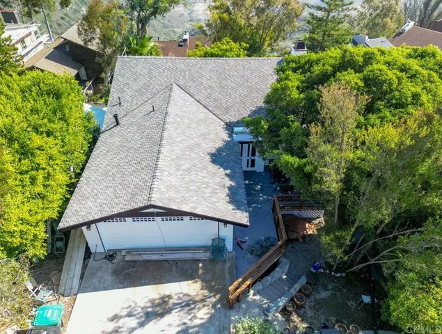 an aerial view of house with yard