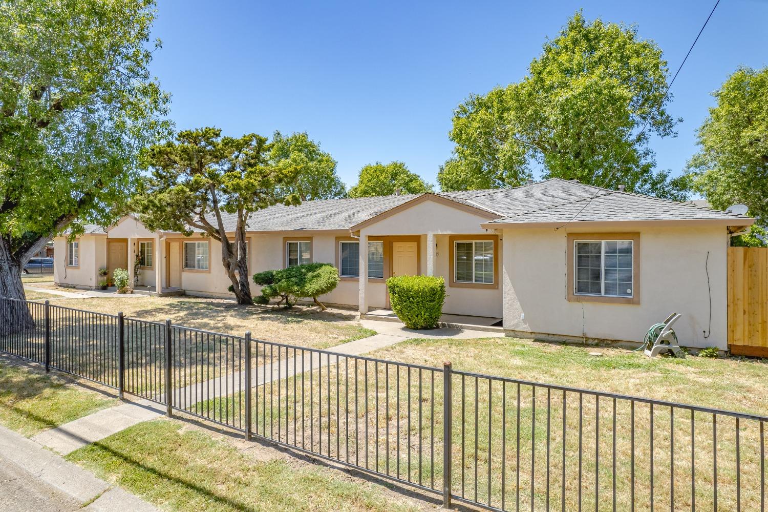 2307 Edison Avenue Sacramento, CA 95821 - Photo 1 of 1 a front view of a house with a garden
