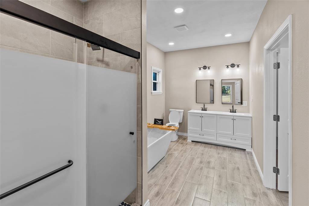 170 High Ridge Drive Azle, TX 76020 - Photo 12 of 36 a bathroom with a double vanity sink mirror and shower