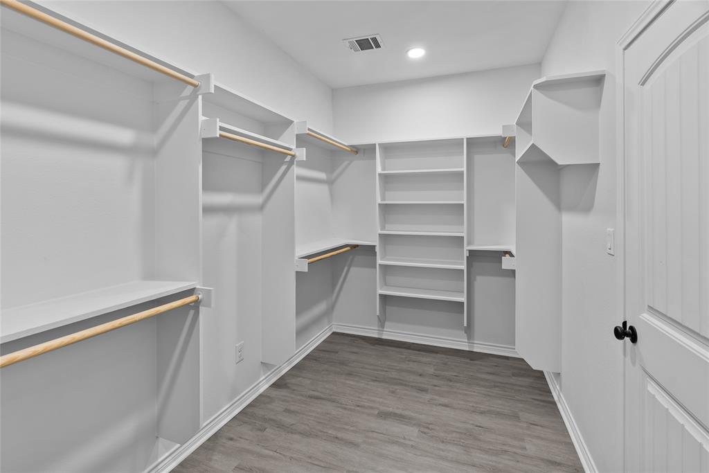 170 High Ridge Drive Azle, TX 76020 - Photo 14 of 36 a view of walk in closet with empty racks