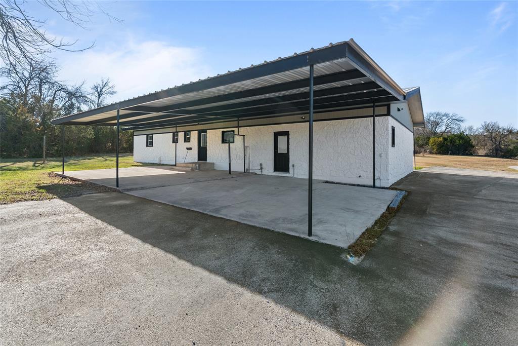 170 High Ridge Drive Azle, TX 76020 - Photo 21 of 36 a view of backyard with barbeque grill and wooden fence
