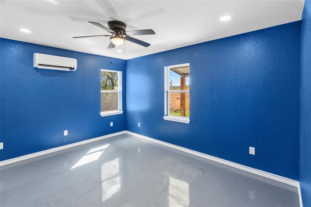 170 High Ridge Drive Azle, TX 76020 - Photo 31 of 36 a view of a livingroom with a ceiling fan and window