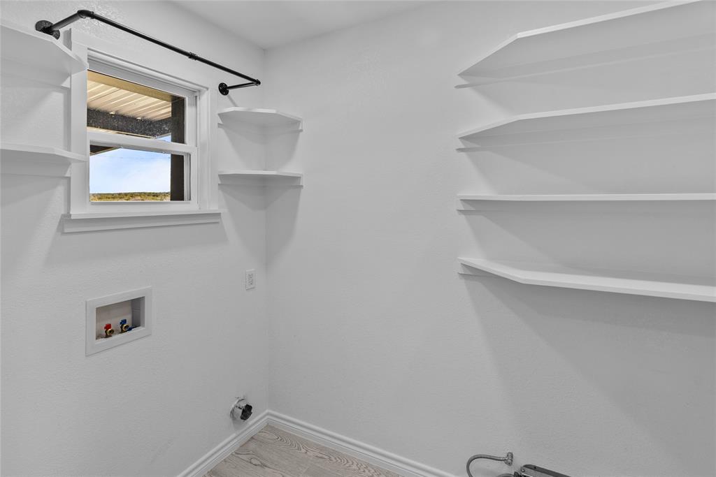 170 High Ridge Drive Azle, TX 76020 - Photo 8 of 36 a view of small space with racks on the wall