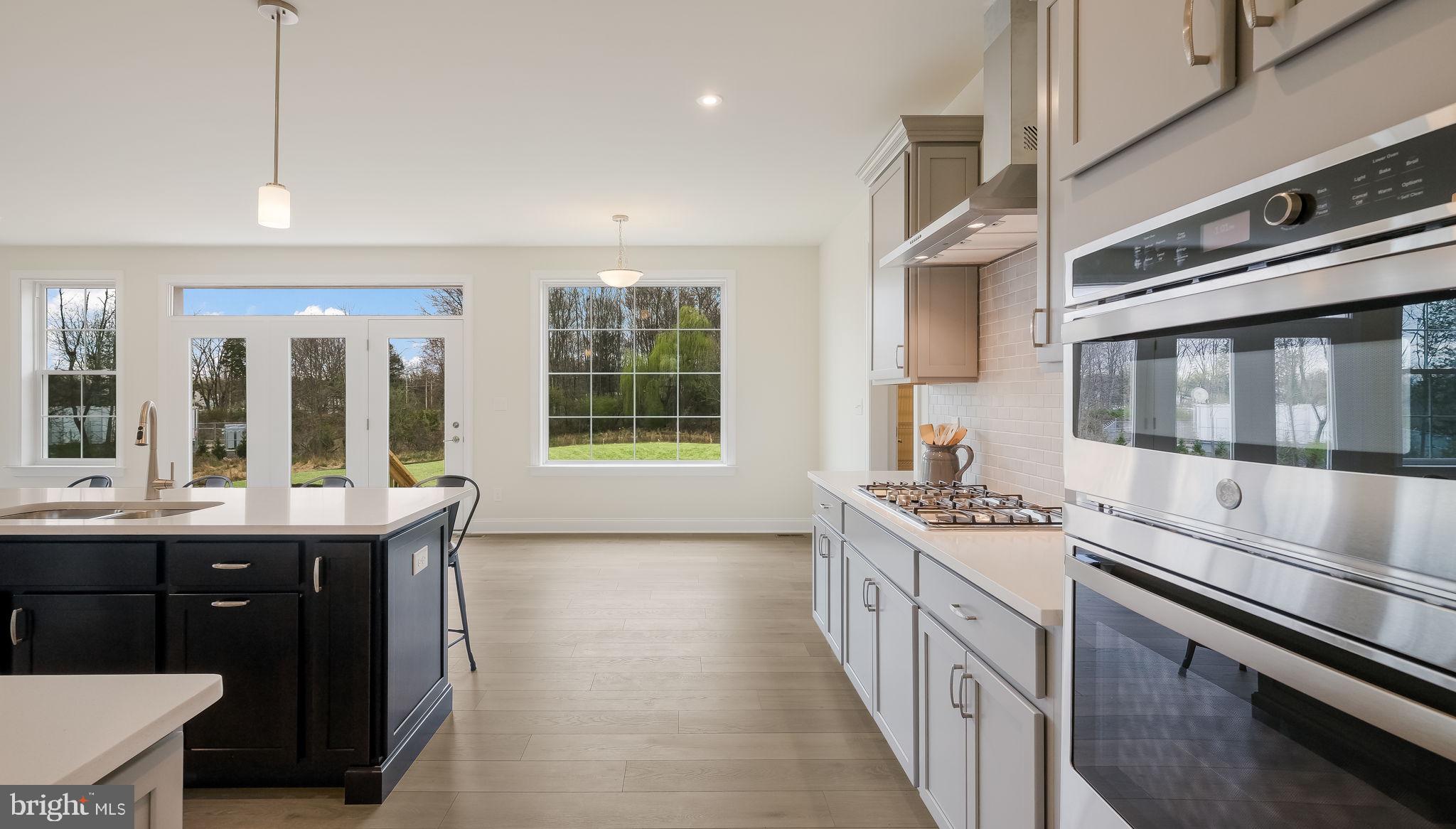 1205 Jordan Lane Perkasie, PA 18944 - Photo 17 of 40 a kitchen with a stove and a sink