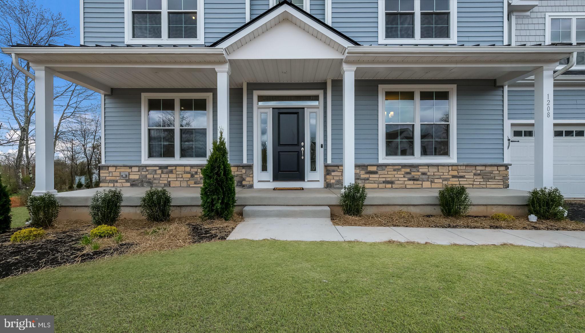 1205 Jordan Lane Perkasie, PA 18944 - Photo 2 of 40 a front view of a house with a yard and outdoor seating