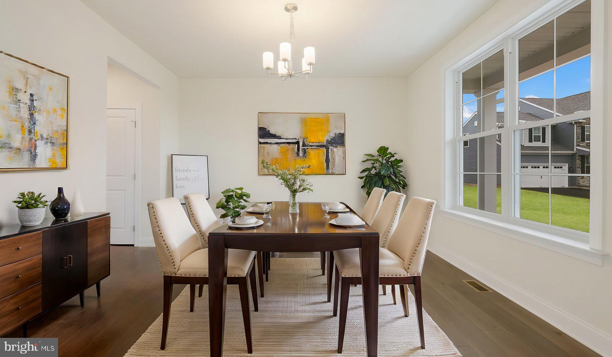 1205 Jordan Lane Perkasie, PA 18944 - Photo 7 of 40 a view of a dining room with furniture and chandelier