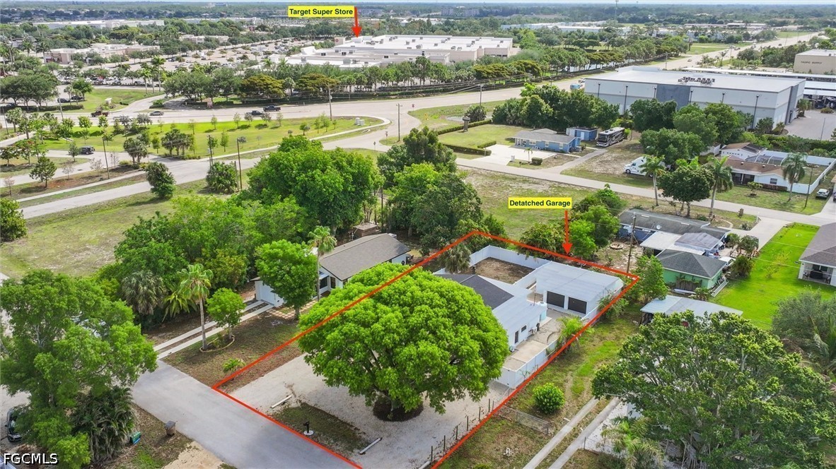 1200 Patterson Road Cape Coral, FL 33909 - Photo 38 of 42 an aerial view of a house with a lake view