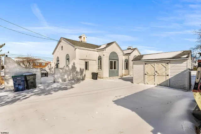 a view of a house with a street