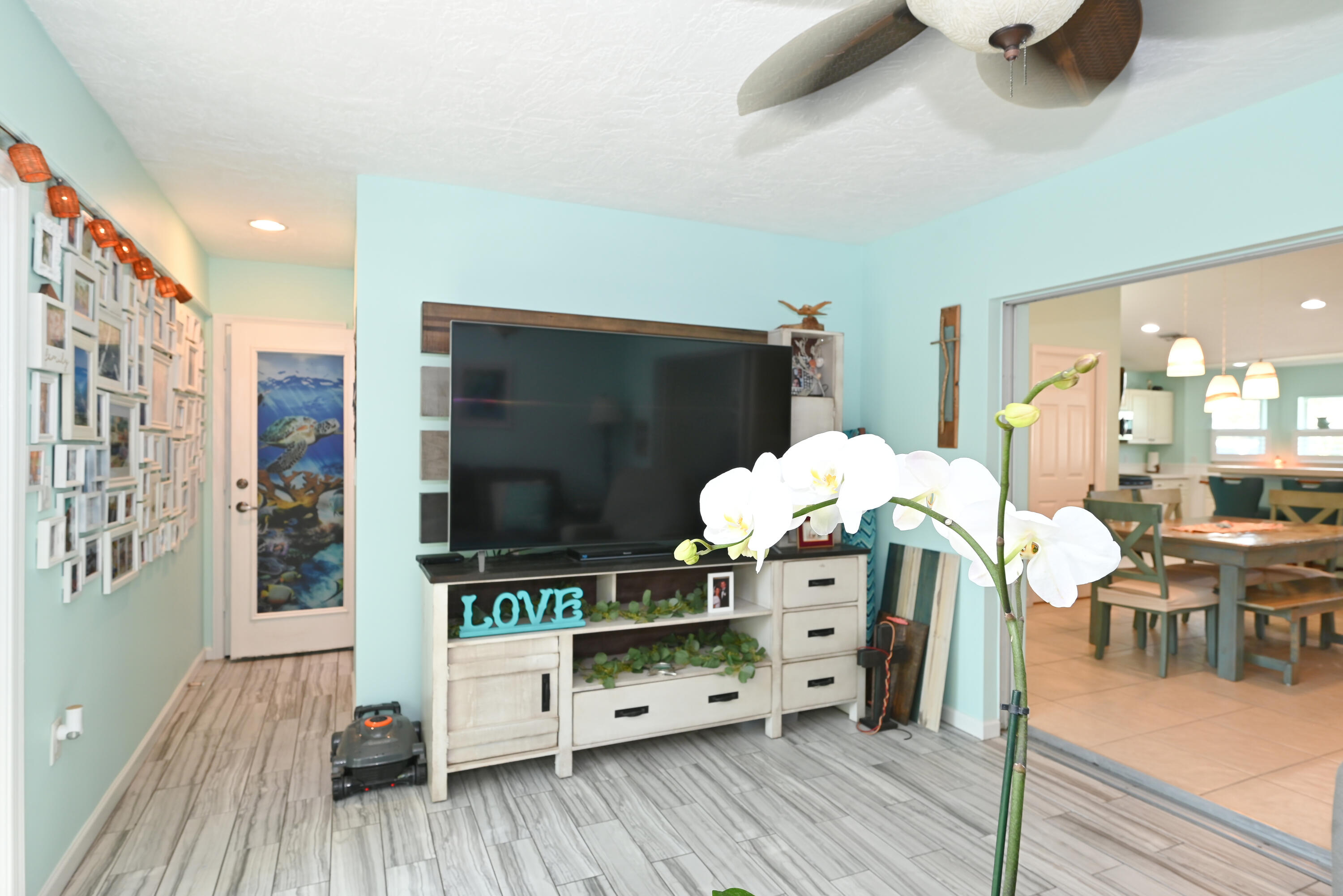 126 Faith Way Jupiter, FL 33458 - Photo 13 of 61 a living room with furniture and a flat screen tv