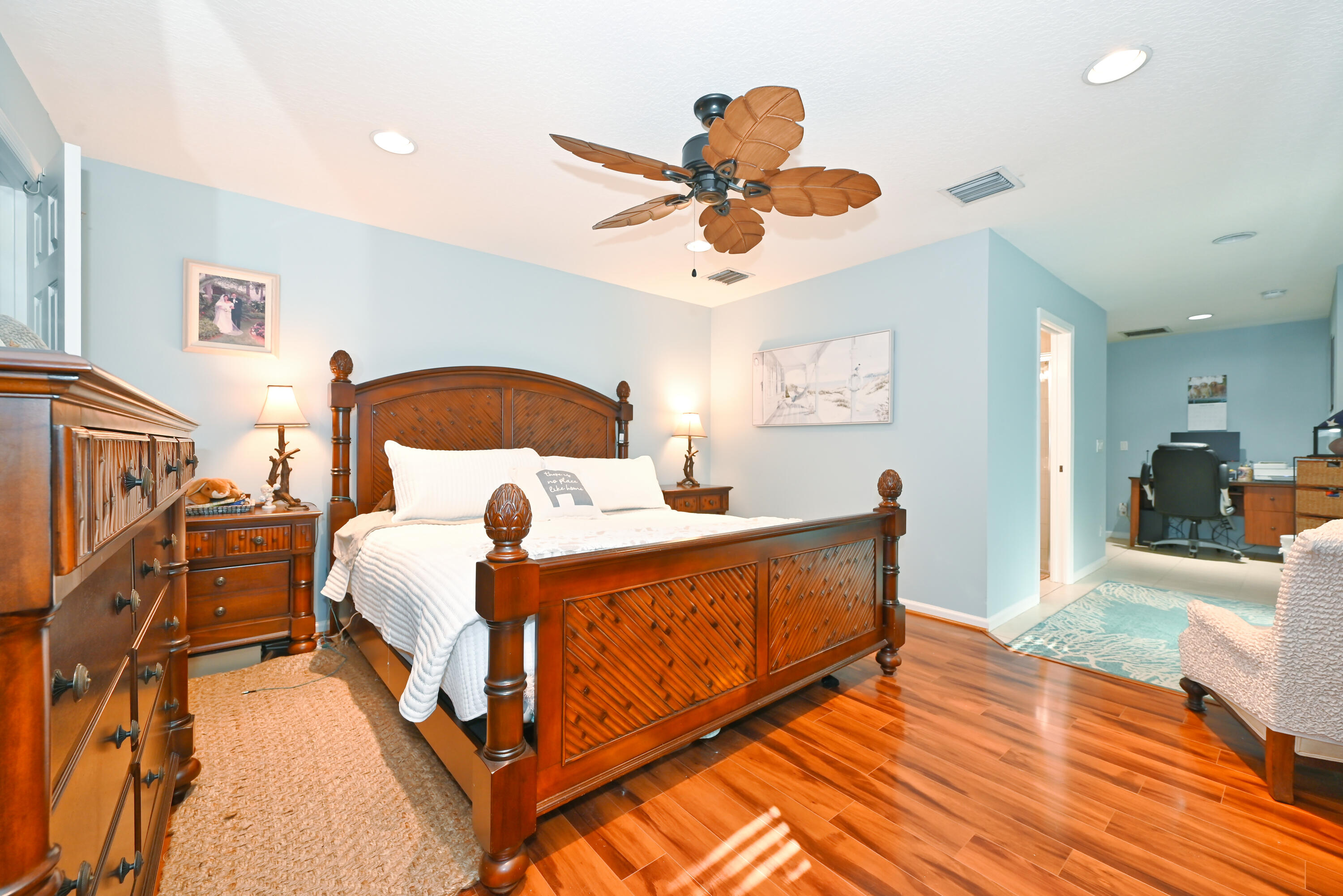 126 Faith Way Jupiter, FL 33458 - Photo 16 of 61 a bed room with a bed and a chandelier