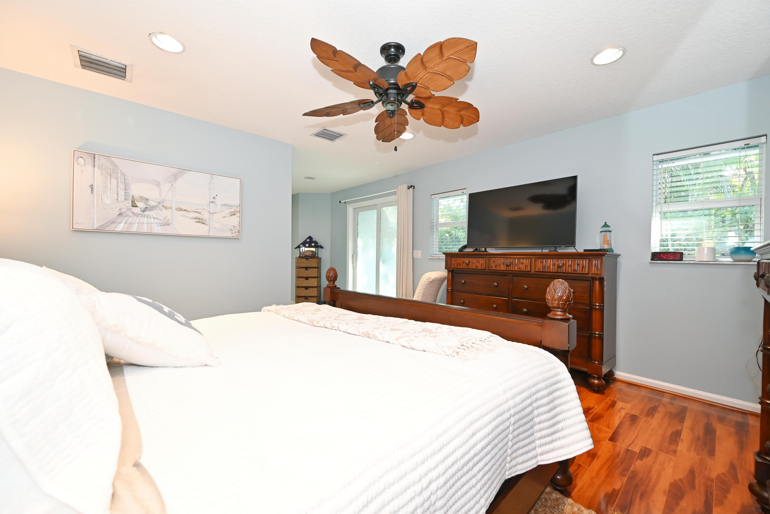 126 Faith Way Jupiter, FL 33458 - Photo 17 of 61 a bedroom with a bed and a flat screen tv