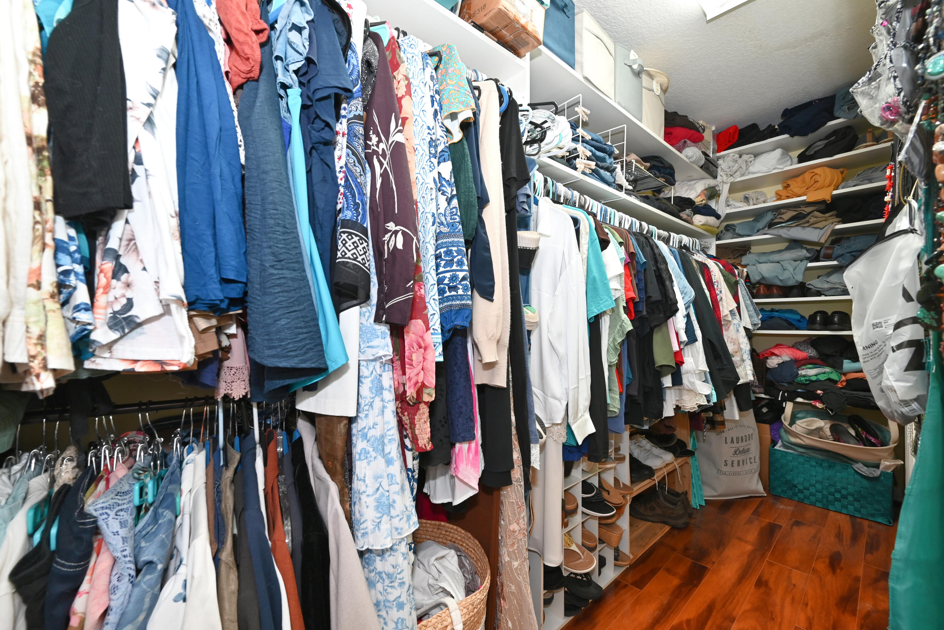 126 Faith Way Jupiter, FL 33458 - Photo 19 of 61 a view of walk in closet with clothes
