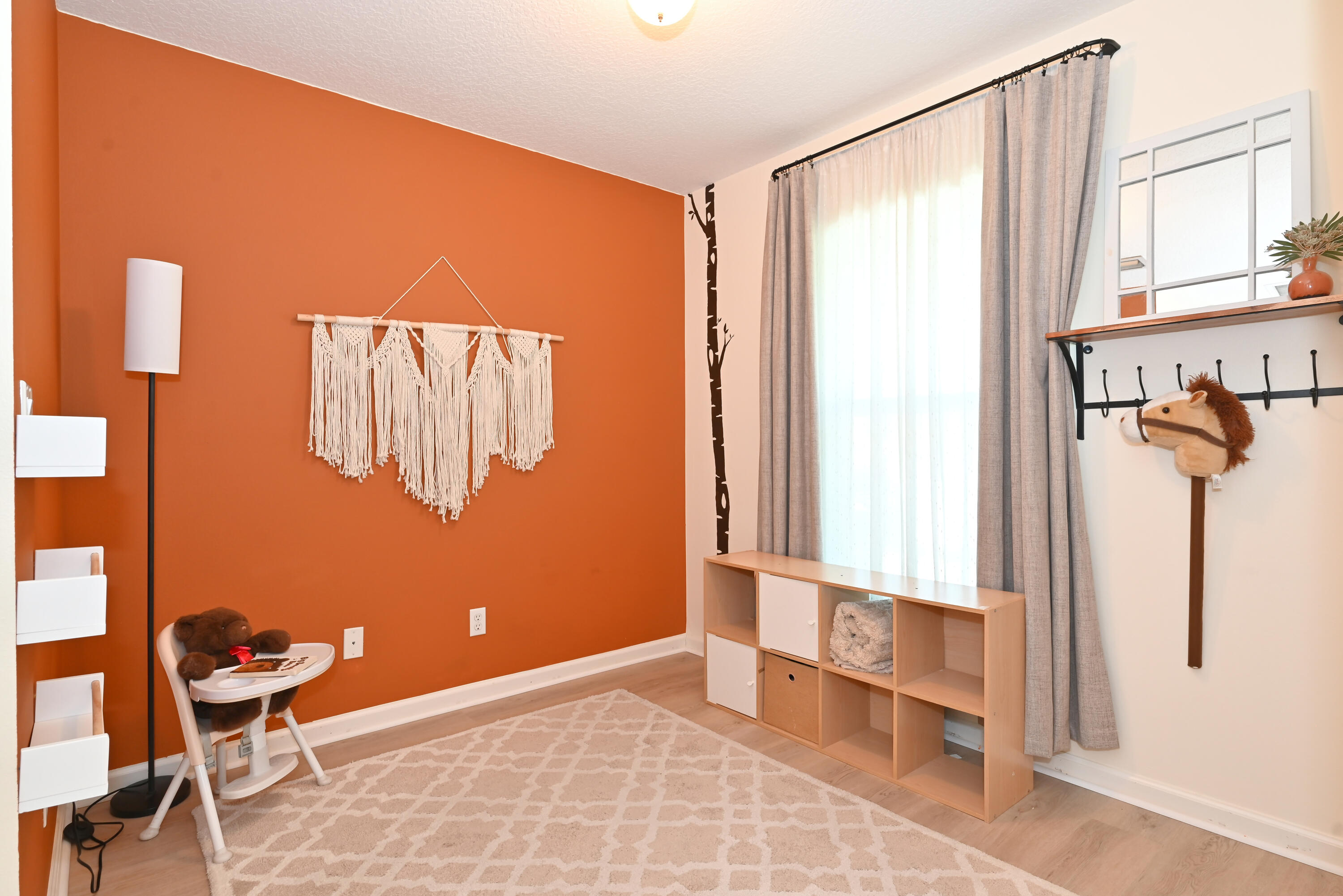 126 Faith Way Jupiter, FL 33458 - Photo 23 of 61 a view of a room with wooden floor and furniture
