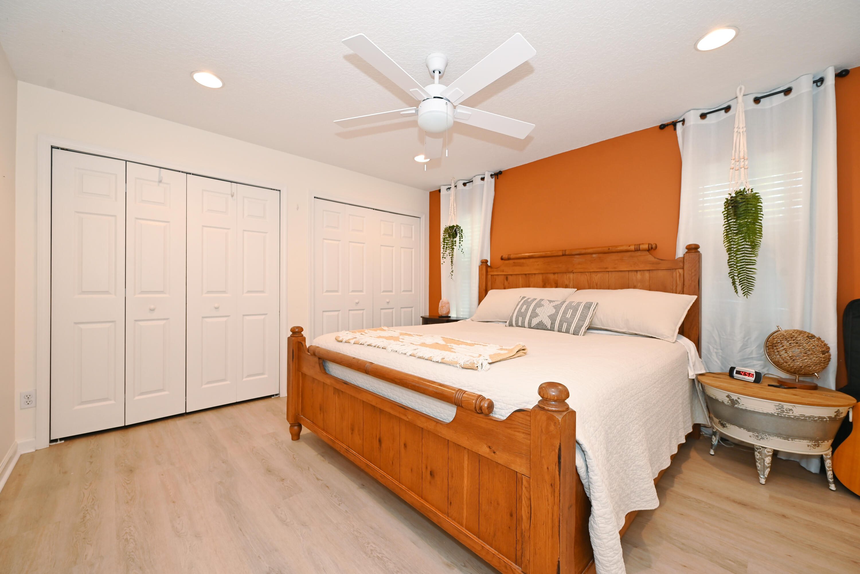 126 Faith Way Jupiter, FL 33458 - Photo 27 of 61 a bedroom with a bed and a chandelier