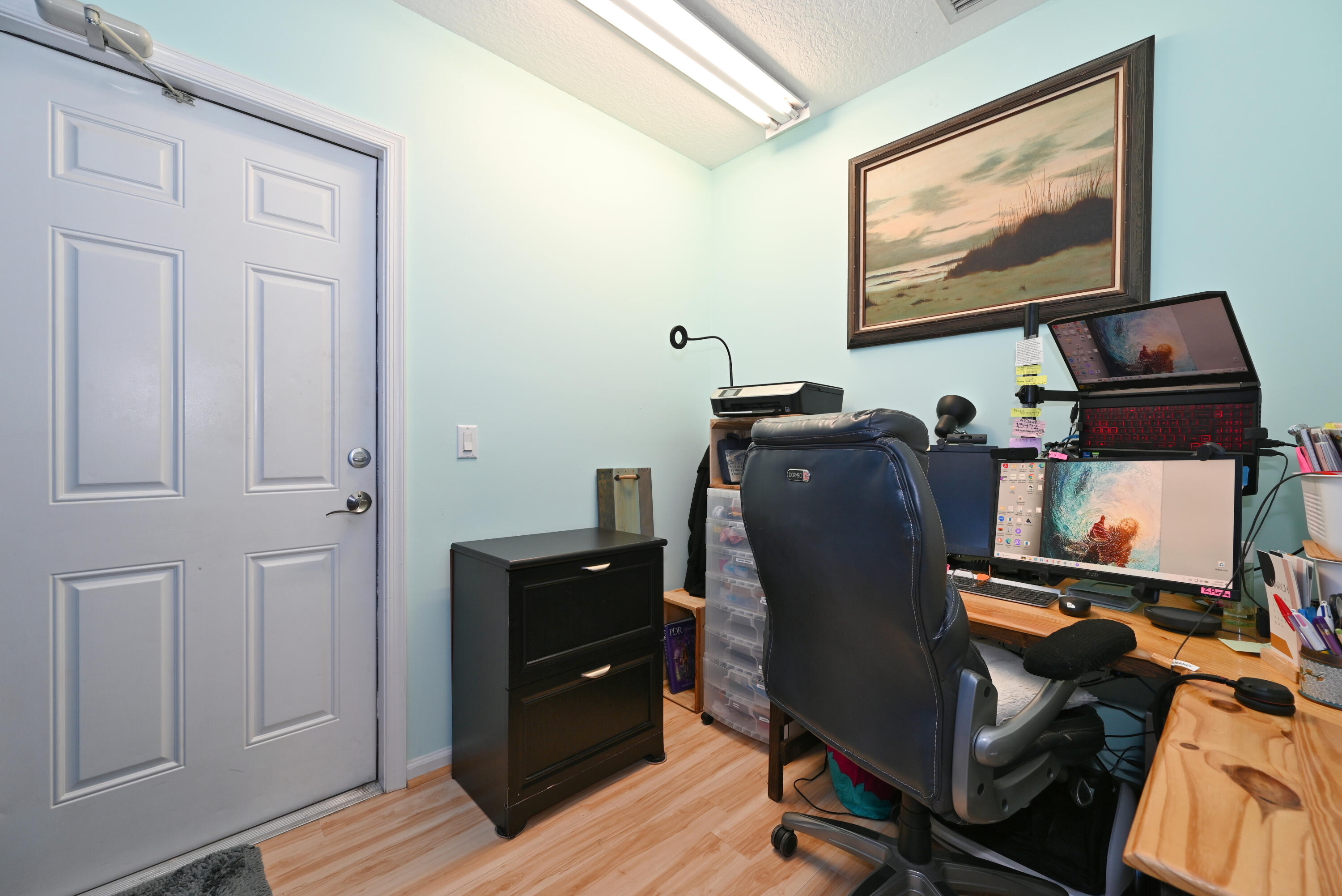 126 Faith Way Jupiter, FL 33458 - Photo 33 of 61 a view of a workspace with furniture and wooden floor