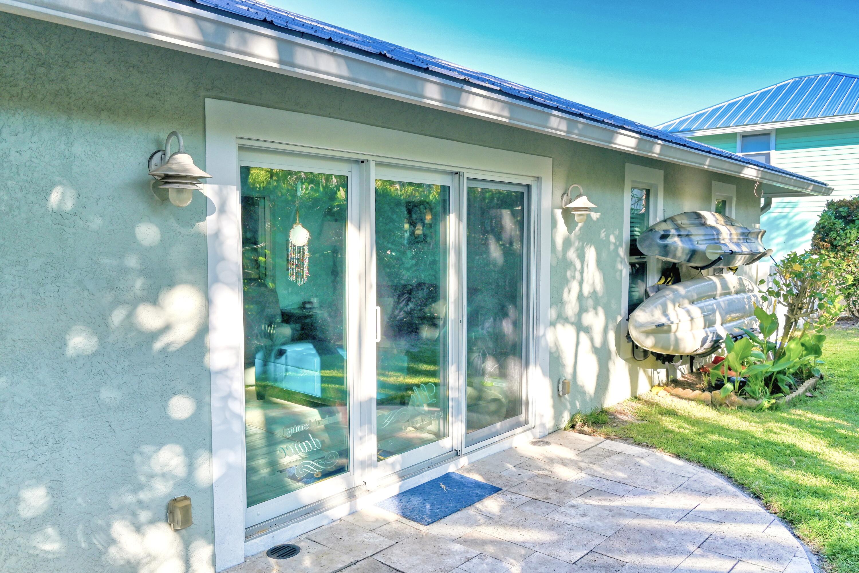 126 Faith Way Jupiter, FL 33458 - Photo 42 of 61 a front view of a house with a yard