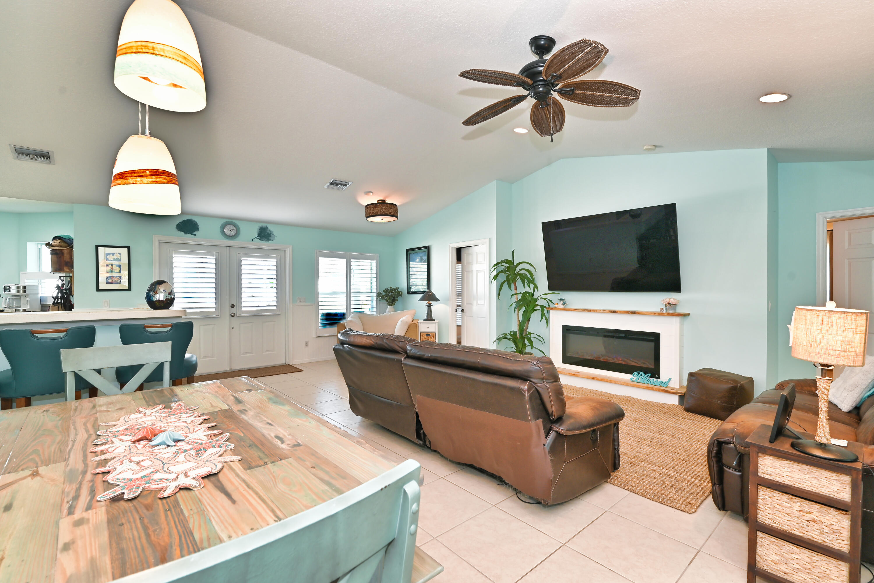 126 Faith Way Jupiter, FL 33458 - Photo 8 of 61 a living room with furniture and a flat screen tv