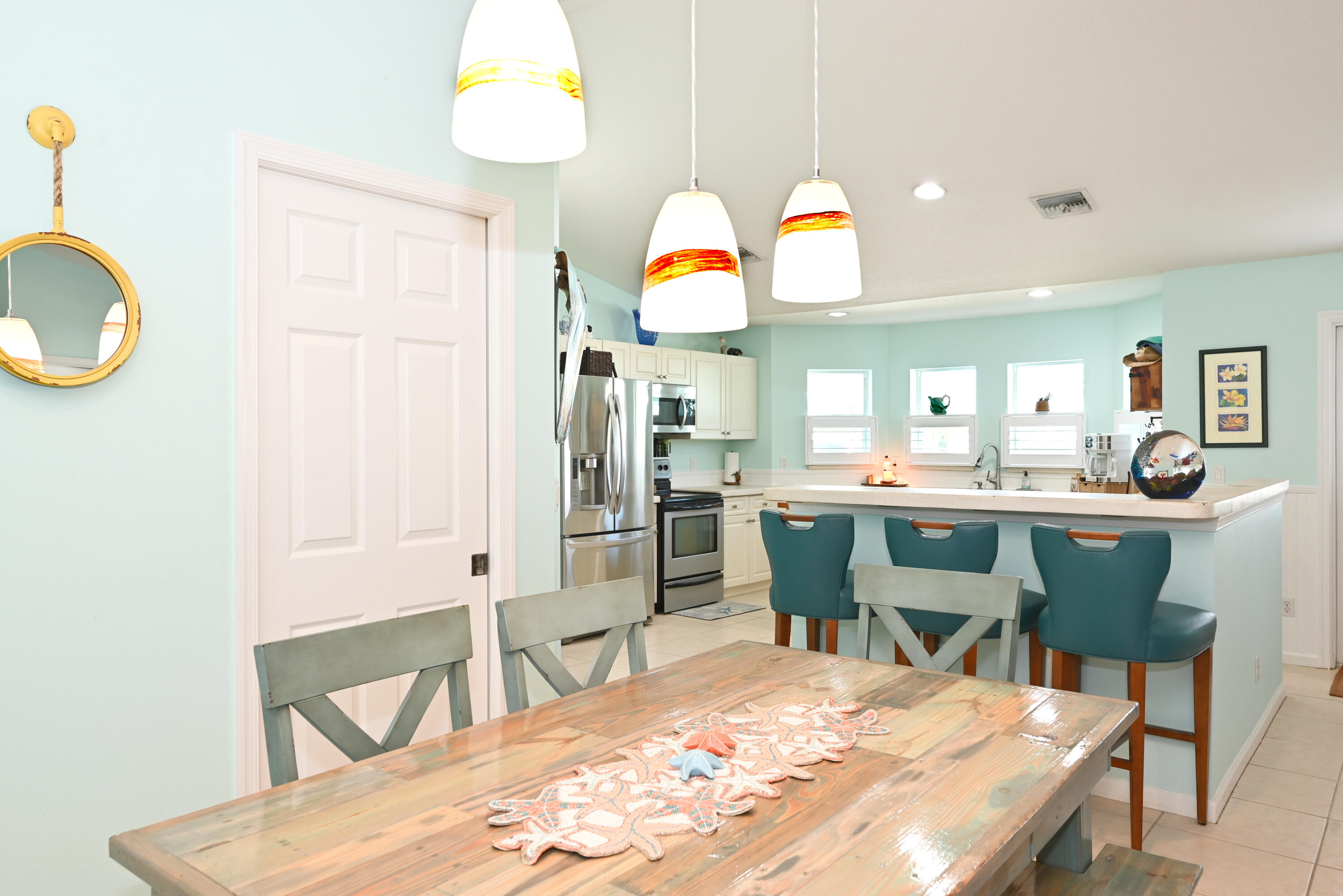 126 Faith Way Jupiter, FL 33458 - Photo 10 of 61 a room with dining table and chairs