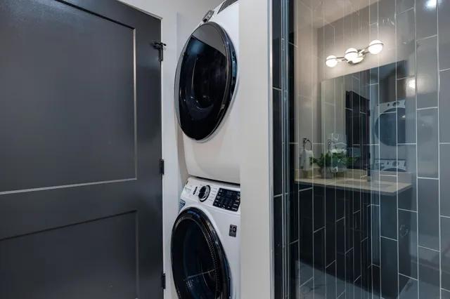 a view of a hallway with washer and dryer