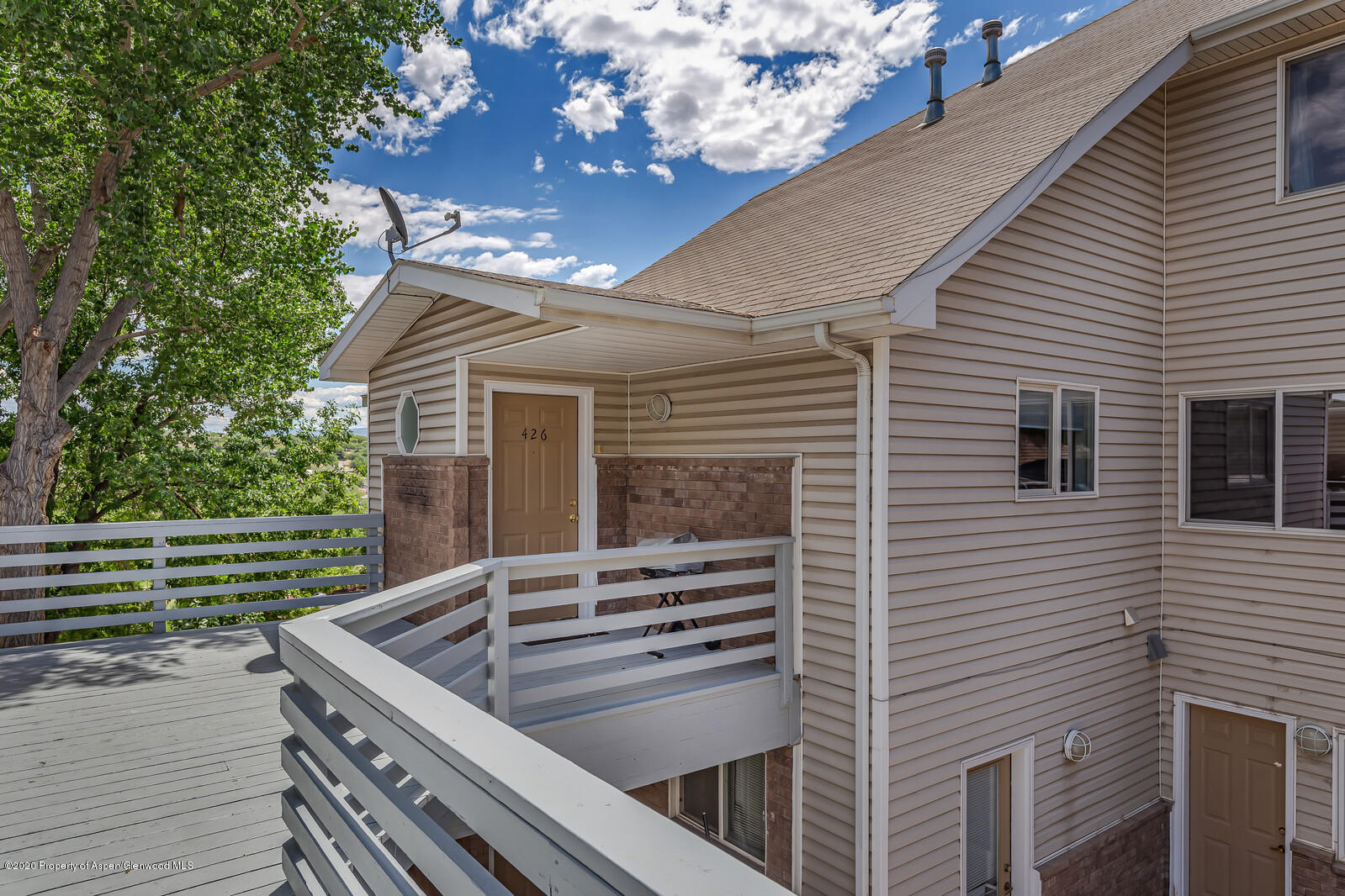 426 Lind Avenue Rifle, CO 81650 - Photo 1 of 20 a view of house with backyard and a tub