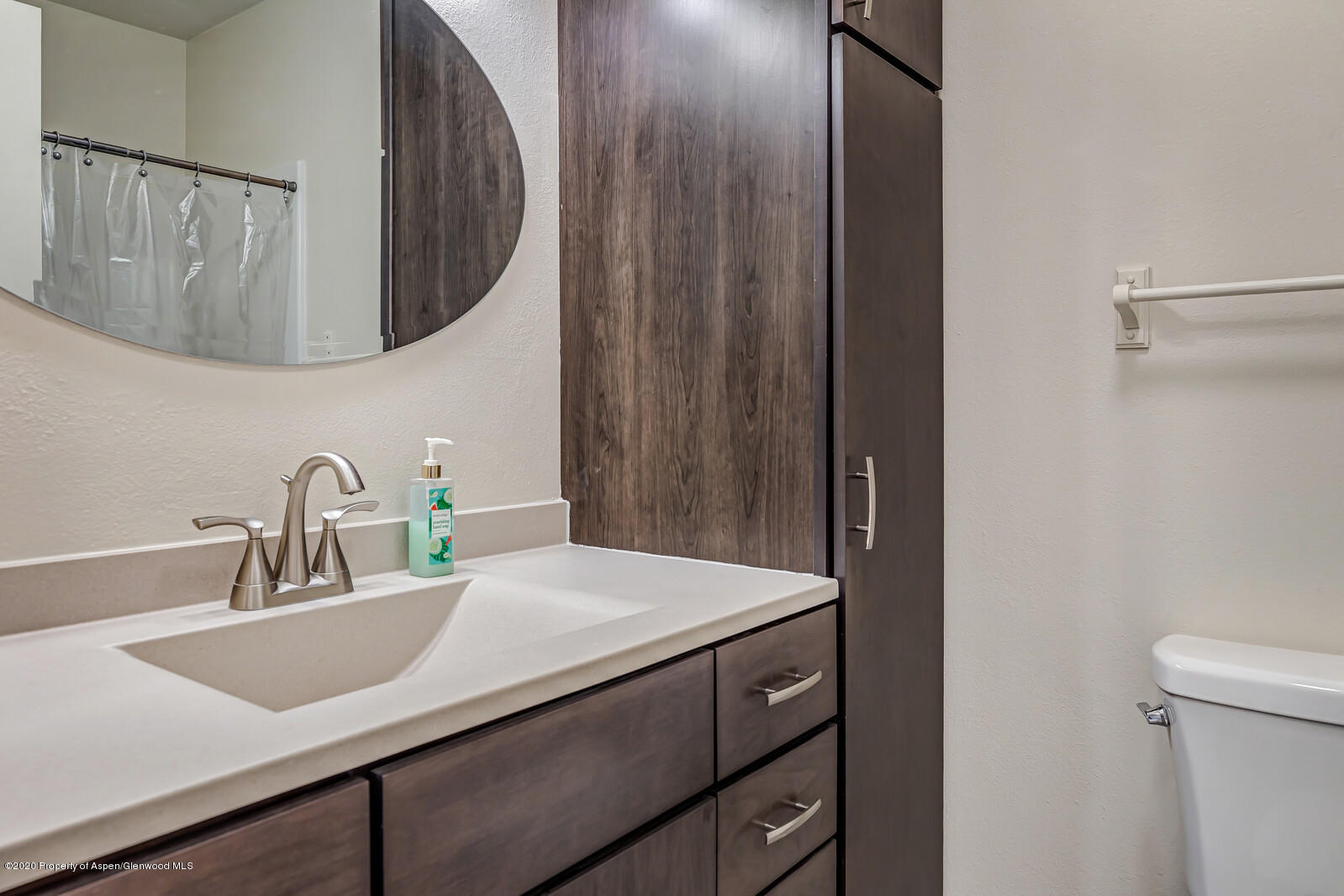 426 Lind Avenue Rifle, CO 81650 - Photo 12 of 20 a bathroom with a sink and a mirror