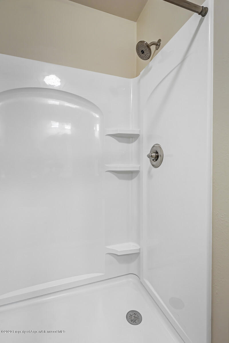 426 Lind Avenue Rifle, CO 81650 - Photo 13 of 20 a bathroom with a shower